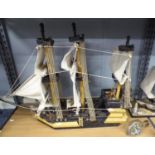 A MODEL GALLEON AND TWO SHIPS IN BOTTLES