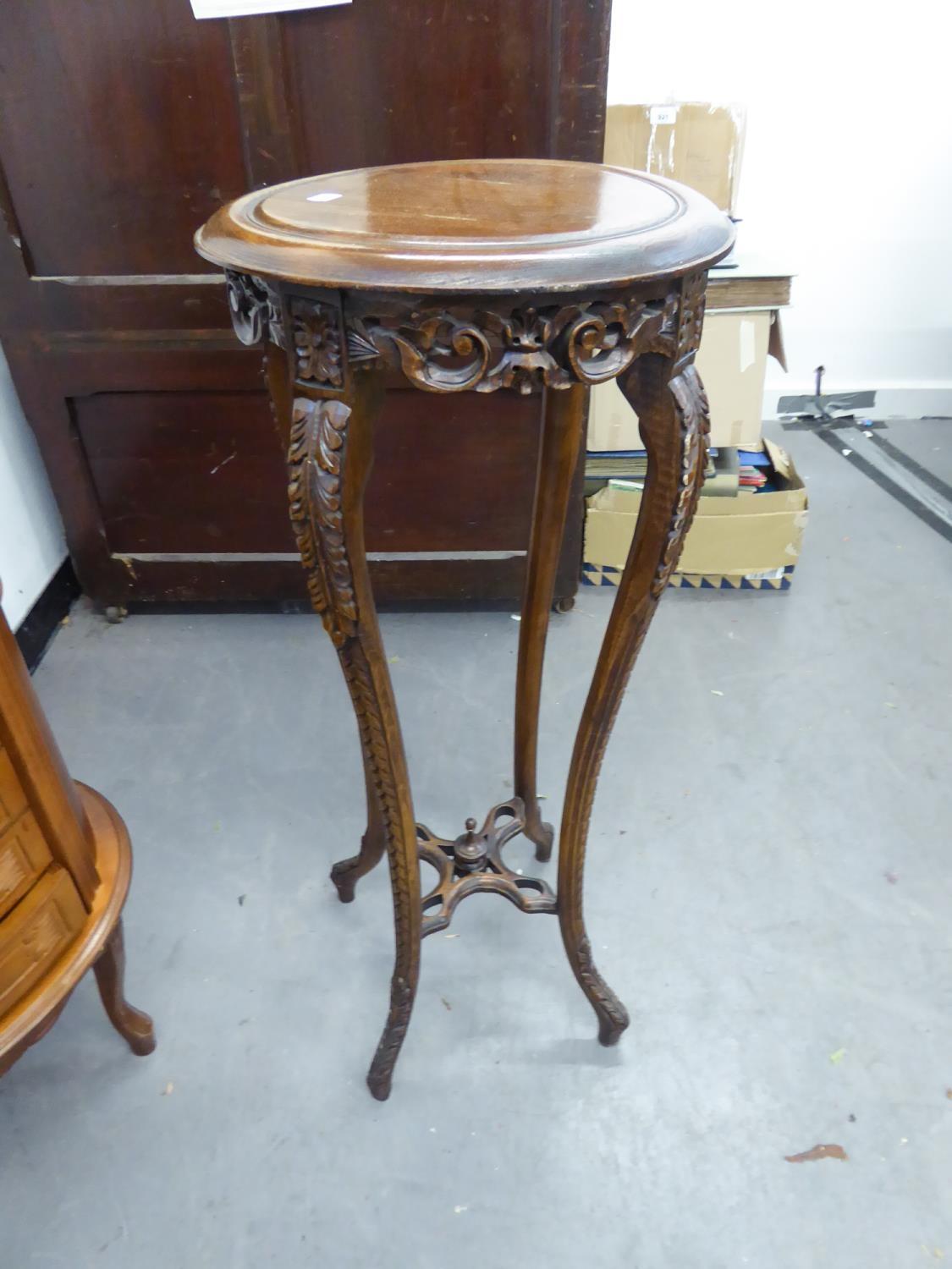 PROFUSELY CARVED OAK JARDINIERE STAND, WITH CIRCULAR TOP ON FOUR SLENDER LEGS