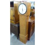 A MODERN LONGCASE CLOCK, THE TEAK CASE FITTED WITH SHELVES