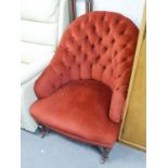 A VICTORIAN SCOOP BACK EASY ARMCHAIR, BUTTON UPHOLSTERD IN WINE RED PLUSH, ON TURNED TAPERING