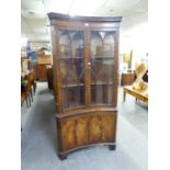 GEORGIAN STYLE MAHOGANY DOUBLE CUPBOARD WITH CONCAVE FRONT, TWO ASTRAGAL GLAZED DOORS OVER TWO PANEL