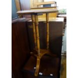 A LATE VICTOIRAN WALNUT OCTAGONAL OCCASONAL TABLE ON THREE TURNED LEGS ON TRIFORM PLATFORM WITH