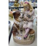 20TH CENTURY PORCELAIN BISQUE FIGURE GROUP OF A YOUNG GIRL SEATED WITH A PUG ON HER KNEE, AND A