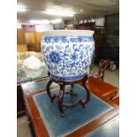 LARGE CHINESE PAINTED BLUE AND WHITE PORCELAIN JARDINIERE, 16" DIAMETER AND THE CHINESE CARVED