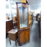 A MAHOGANY BOW FRONTED DOUBLE CORNER CUPBOARD, WITH A SINGLE GLAZED DOOR ABOVE THE ADVANCED BASE