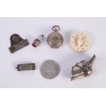 MINIATURE ELECTROPLATED METAL PIECE OF ARMOUR OR FINGER ORNAMENT IN THE FORM OF AN ARMGUARD OR