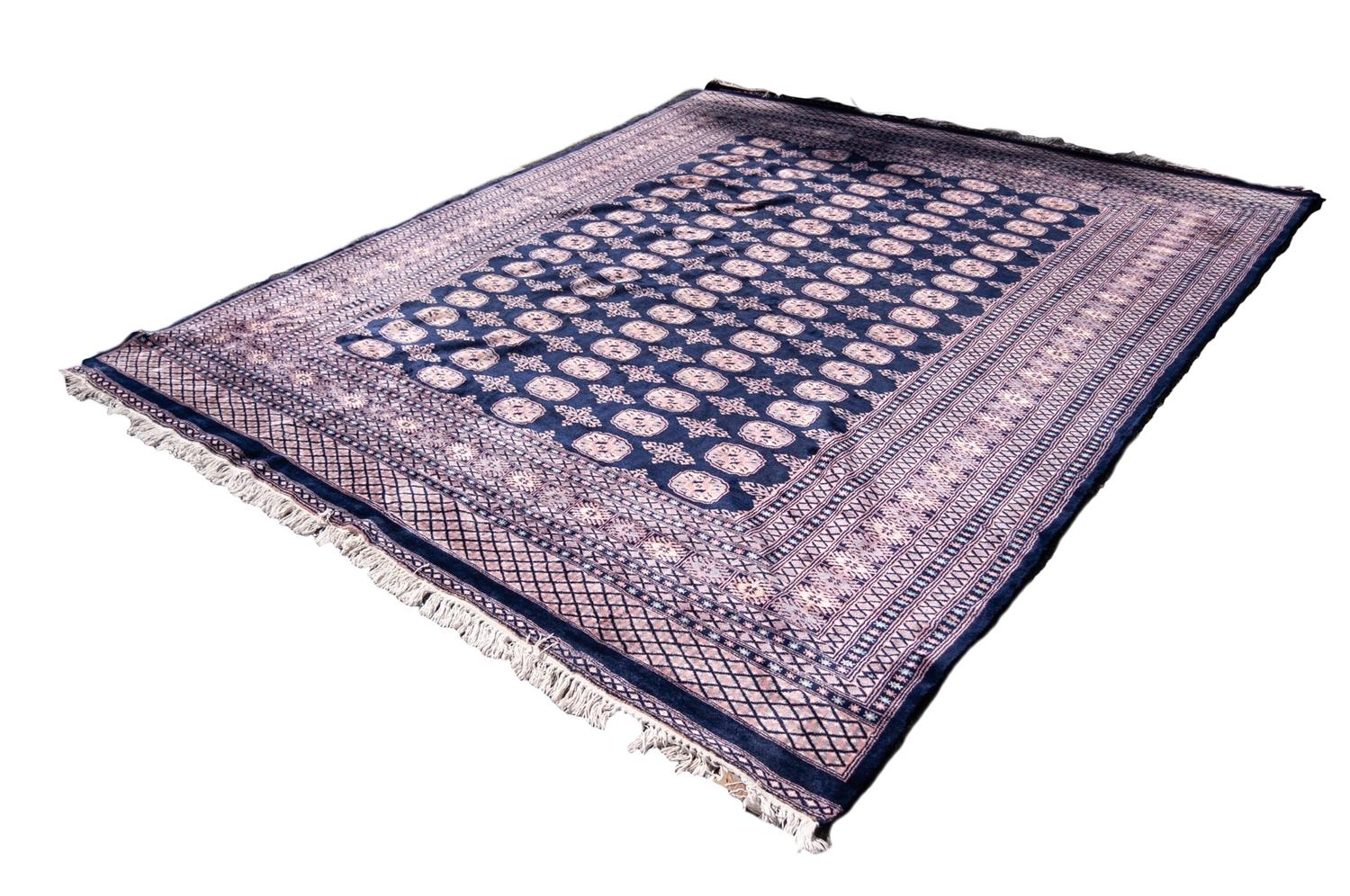 PAKISTAN BOKHARA WOOL CARPET with five rows of primary guls on a midnight blue field, multiple