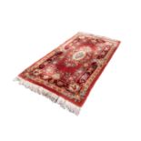 CHINESE LARGE RUG WITH EMBOSSED AUBUSSON ROSE DESIGN, off-white centre oval medallion on a red