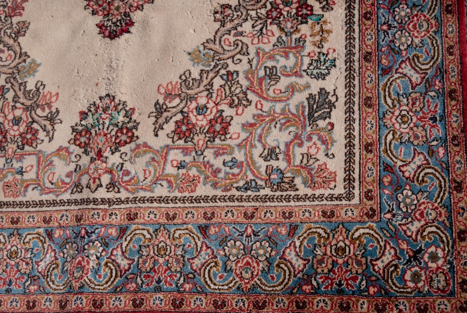 QUM PERSIAN WOOL RUG with floral centre medallion with pendant and surround, on plain white field, - Image 2 of 3