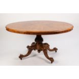 MID VICTORIAN INLAID AND FIGURED WALNUT TILT-TOP BREAKFAST TABLE, the quarter cut and moulded oval