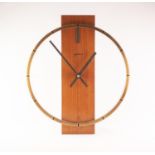 STYLISH 1970?s KEINZLE TEAK AND GILT METAL BATTERY OPERATED WALL CLOCK, with oversized chapter