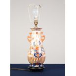 AN EARLY 20th CENTURY JAPANESE IMARI PORCELAIN no handled baluster shape vase, now as an electric