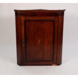 GEORGE III OAK HANGING CORNER CUPBOARD with cavetto cornice, framed panel door with centre marquetry