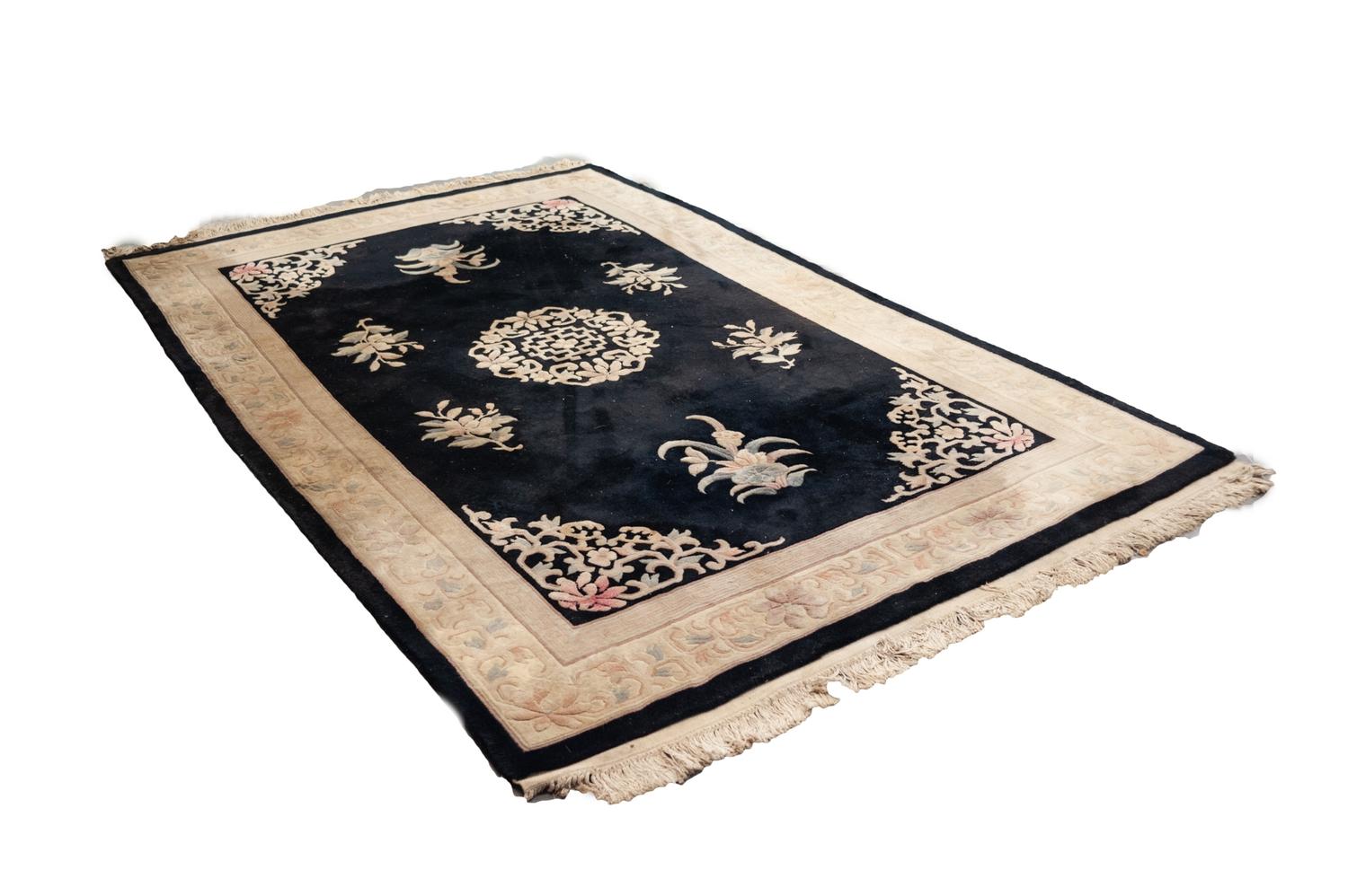 HEAVY QUALITY WASHED CHINESE EMBOSSED CARPET with circular centre floral medallion and spandrels