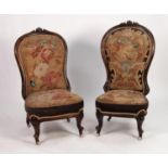 PAIR OF VICTORIAN CARVED WALNUT NURSING CHAIRS the show wood balloon backs and low seats upholstered