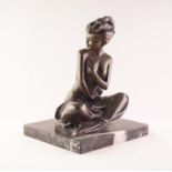 GREEN PATINATED BRONZE SEMI NAKED FEMALE FIGURE, modelled semi-draped and seated cross-legged, on