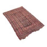 BELUCHI CENTRAL ASIAN RUG principally in colours, red, wine red, orange, etc., with intricately