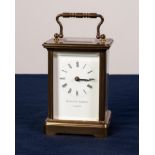 A POST WAR ENGLISH BRASS CASED CARRIAGE CLOCK the white enamel dial inscribed "Mathew Norman,