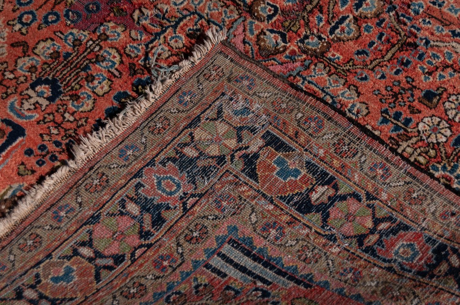 SAROUK PERSIAN RUG with all-over design of vases of stylised flowering shrubs on a pink field, - Image 3 of 3