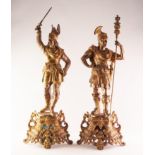 PAIR OF GILT SPELTER AND PORCELAIN MOUNTED FIGURES OF SOLDIERS, one modelled as a Nordic warrior,