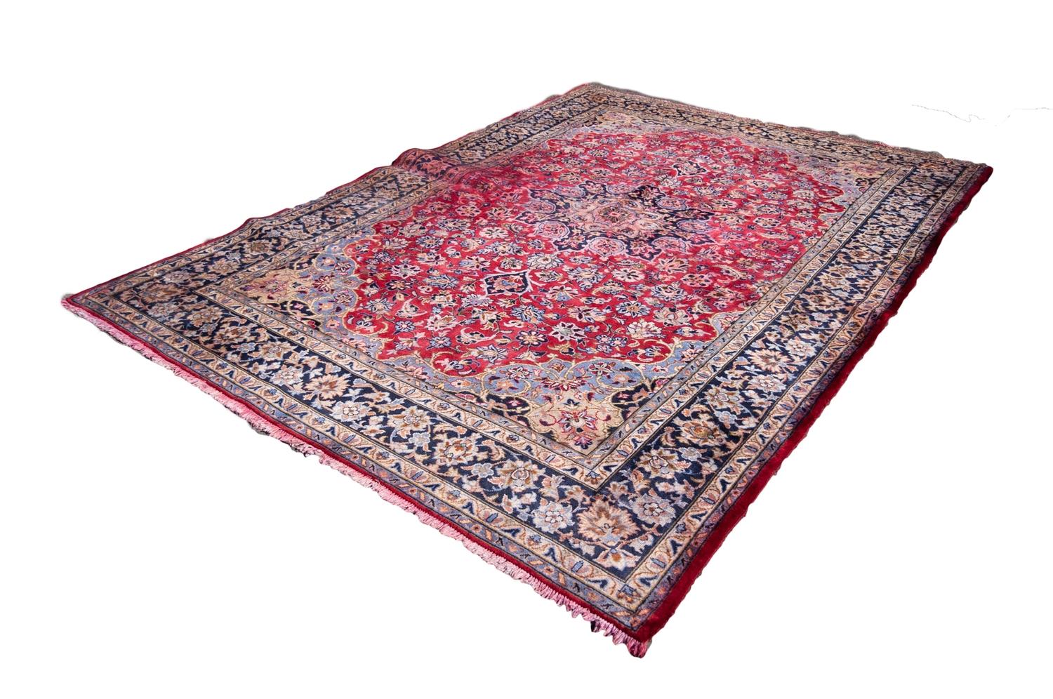 KIRMAN PERSIAN HAND-MADE CARPET with circular petal form centre medallion in midnight blue with