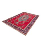 TABRIZ PERSIAN CARPET with large centre oval medallion principally in pale blue with pendants, on
