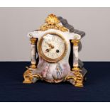 FRENCH ORMOLU MOUNTED PORCELAIN MANTEL CLOCK with eight day movement striking on a coiled gong,