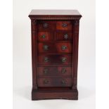 GEORGIAN STYLE FLAME CUT MAHOGANY WELLINGTON CHEST BY JAYCEE FURNITURE, the moulded oblong top above