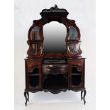 LATE VICTORIAN CARVED AND PIERCED DARK MAHOGANY MIRROR BACK SIDE CABINET, the shaped back with