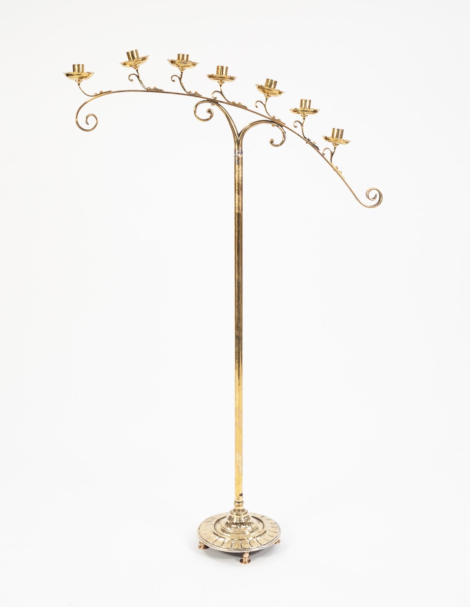 HARRIS & SHELDON, BIRMINGHAM, GOTHIC STYLE BRASS SEVEN LIGHT FLOOR STANDING CANDLE HOLDER, the