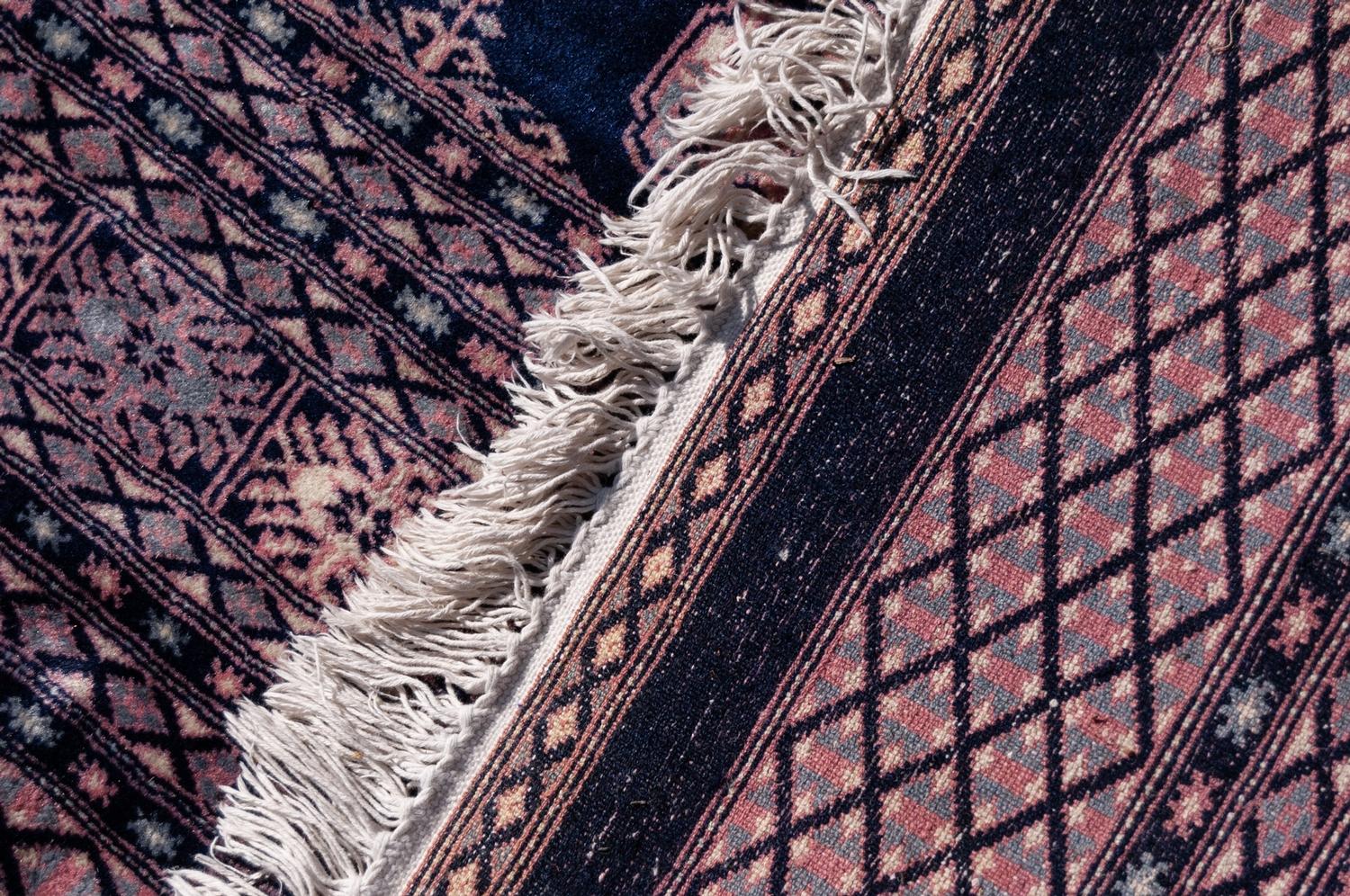 PAKISTAN BOKHARA WOOL CARPET with five rows of primary guls on a midnight blue field, multiple - Image 2 of 3