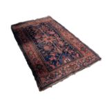 FERAGHAN PERSIAN RUG WITH TYPICAL HERATI PATTERN on a midnight blue field, with small triangular