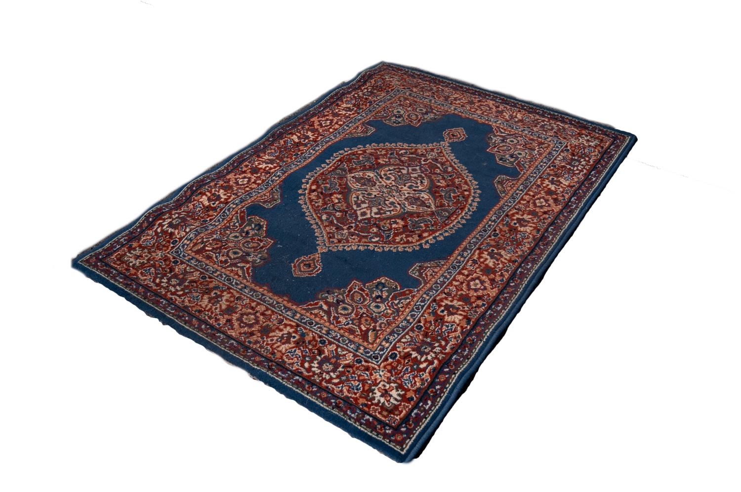 PERSIAN SEMI ANTIQUE GOREVAN RUG with concentric diamond shaped pale blue medallion in a larger