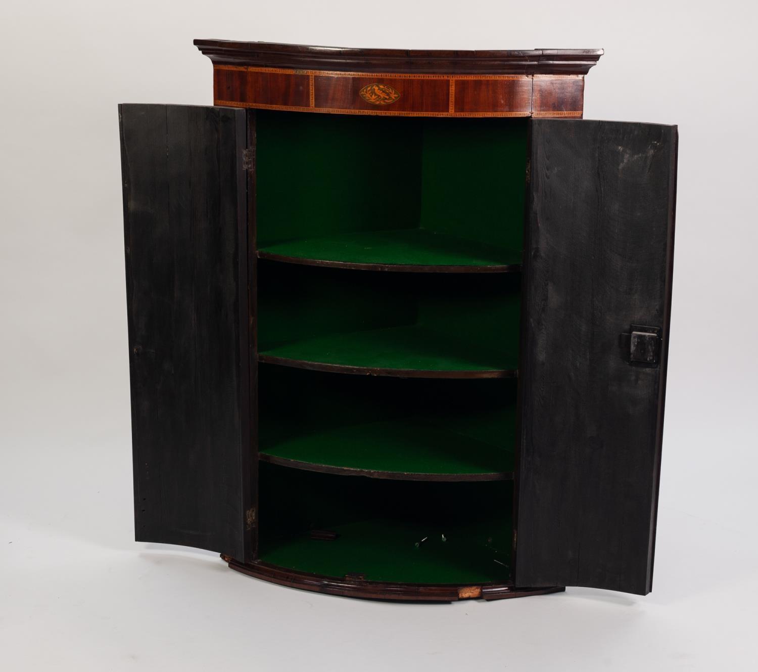 GEORGE III INLAID MAHOGANY BOW FRONTED CORNER CUPBOARD, the moulded cornice above a frieze with - Image 2 of 2