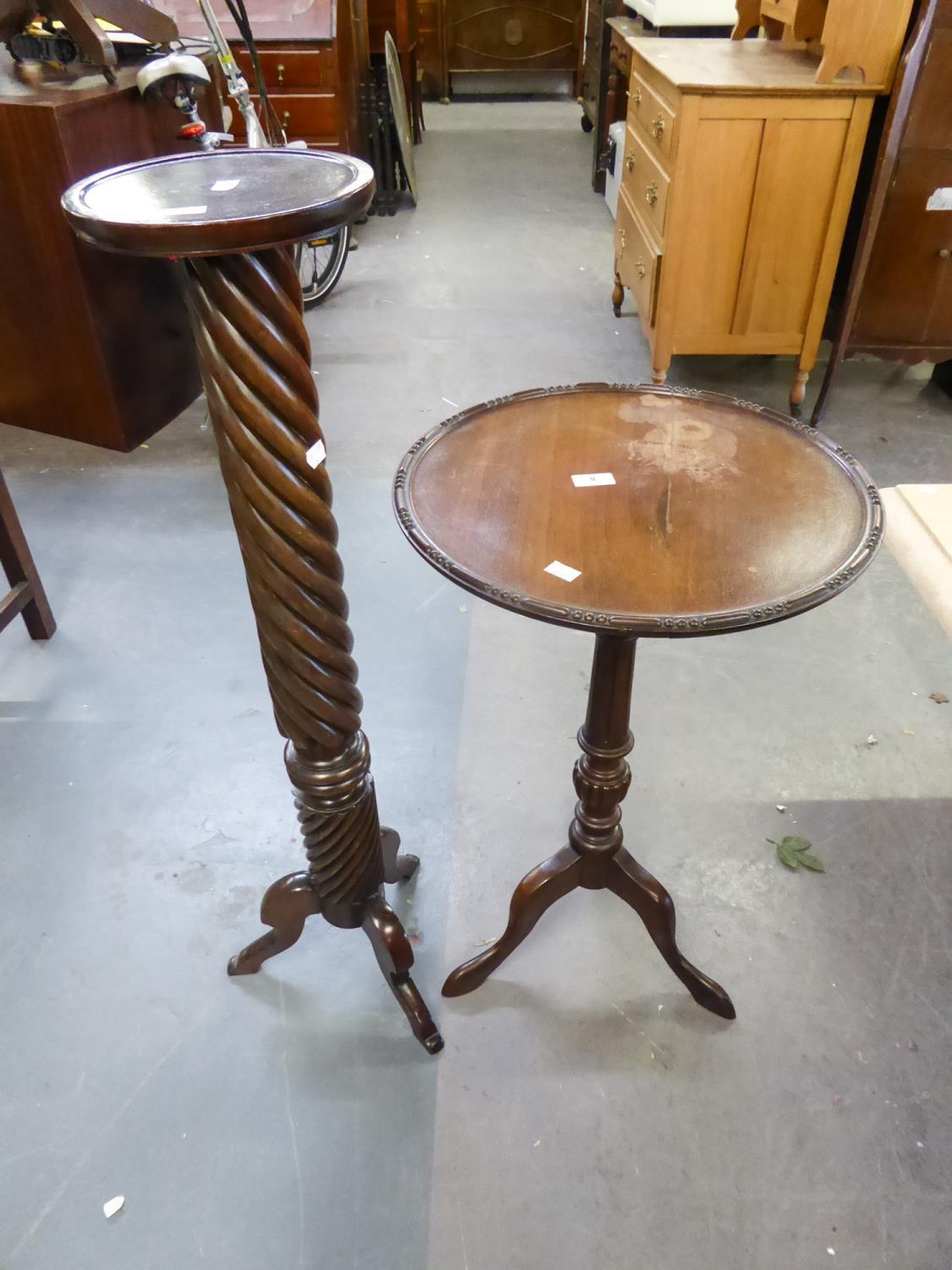 A MAHOGANY TORCHERE OR PLANT STAND ADAPTED FROM A VICTORIAN BED POST, ALSO A REPRODUCTION TRIPOD