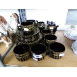 TWENTY TWO PIECES OF EARLY 1900's STAFFFORDSHIRE BLACK GLAZED ENAMELLED AND GILT DECORATED TEA WARES