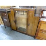 1930's MAHOGANY DISPLAY CABINET, HAVING GLAZED CENTRAL DOOR, FLANKED BY SOLID CUPBOARDS