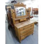 A SATIN WQOOD DRESSING TABLE OF 3 LONG GRADUATED DRAWERS AND SWING MIRROR