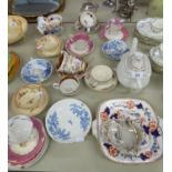 TWELVE VICTORIAN CHINA SPECIMEN TEA CUPS AND SAUCERS, THREE WITH MATCHING SIDE PLATES; ONE MATCHING,