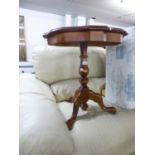 MAHOGANY CIRCULAR LOW OCCASIONAL TABLE WITH DECORATIVE INLAY, RIBBED EDGE, TURNED PEDESTAL AND TIPOD