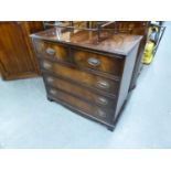 A FLAME MAHOGANY CHEST OF TWO SHORT AND THREE LONG DRAWERS