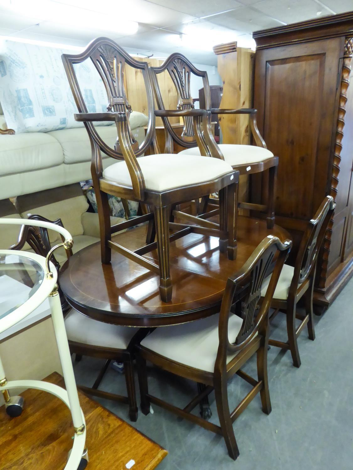 A MAHOGANY REPRODUCTION DINING TABLE AND SIX CHAIRS (4 + 2) (7)