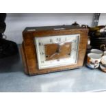 A 1930's OAK CASED MANTEL CLOCK