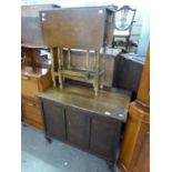 A MID TWENTIETH CENTURY OAK BEDDING BOX, ON SQUARE SOLID SUPPORTS AND A SMALL OAK GATELEG TABLE (2)