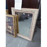A LARGE OBLONG BEVELLED EDGE WALL MIRROR WITH BLUSH AND GILT FRAME