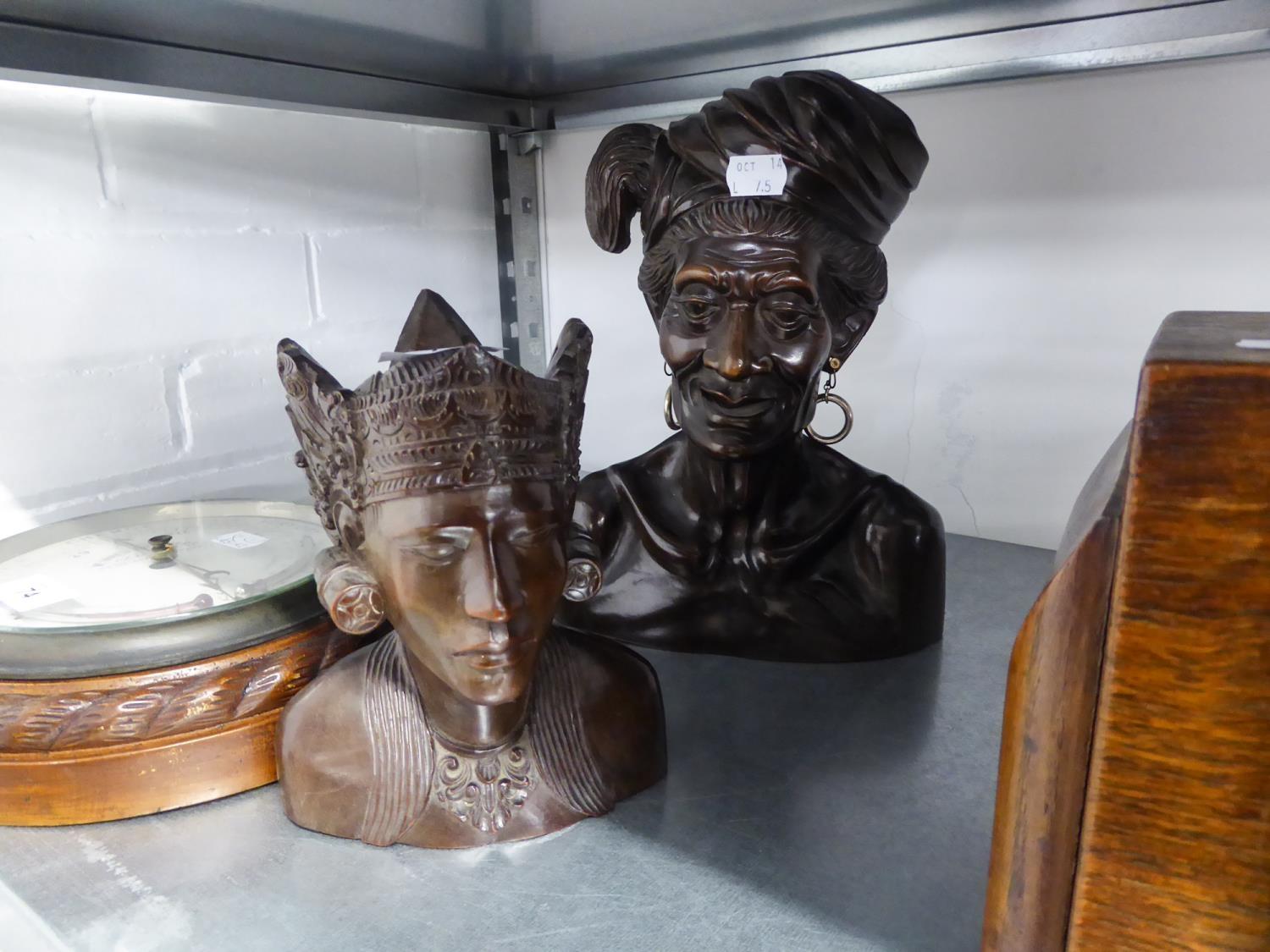 TWO SOUTH EAST ASIAN CARVED WOODEN HEADS