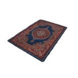 PERSIAN SEMI ANTIQUE GOREVAN RUG with concentric diamond shaped pale blue medallion in a larger