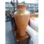 A LARGE TERRACOTTA URN WITH GILT DECORATION