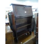 A MID TWENTIETH CENTURY SMALL OAK BUREAU/BOOKCASE AND A BED WARMING PAN (2)