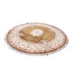 GOOD QUALITY INDIAN CIRCULAR CARPET with off-white and floral circular centre medallion on a plain